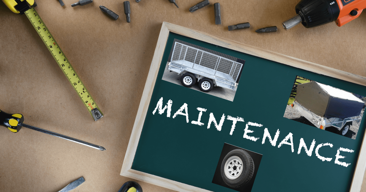 Trailer maintenance concept with tools, measuring tape, and photos of trailers and trailer wheel on a chalkboard labelled Maintenance